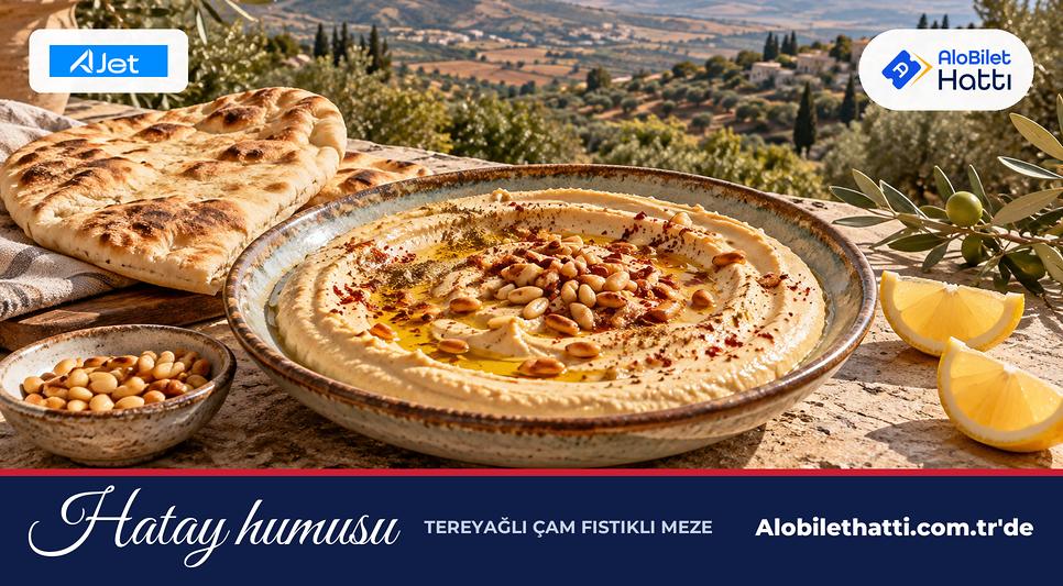Üzeri tereyağında kavrulmuş çam fıstıklı humus tabağı ve pide