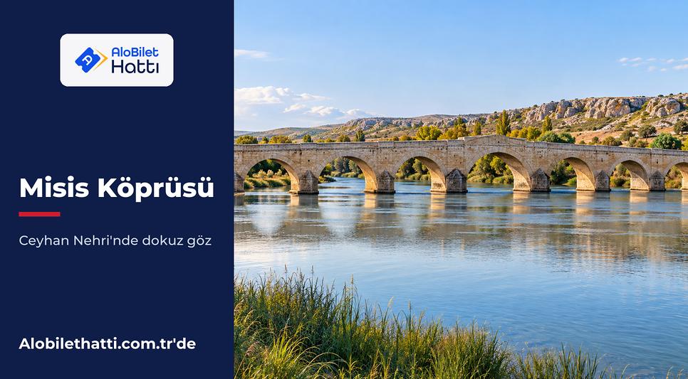 Geniş bir nehrin üzerinde uzanan çok kemerli eski taş köprü